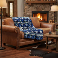 Native Pattern Fleece Western Blanket in blue and black by Rockmount Ranch Wear, fleece throw on sofa