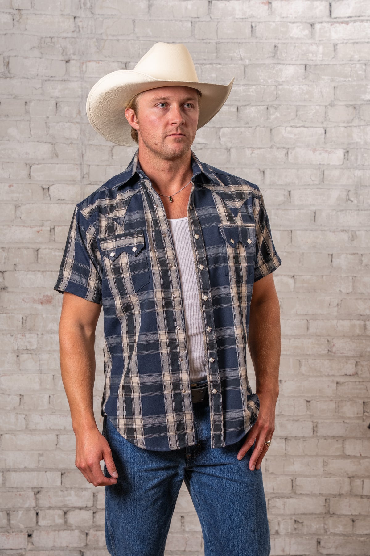 Men's Blue Short Sleeve Plaid Western Shirt by Rockmount Ranch Wear in denim with sawtooth pockets and diamond snaps