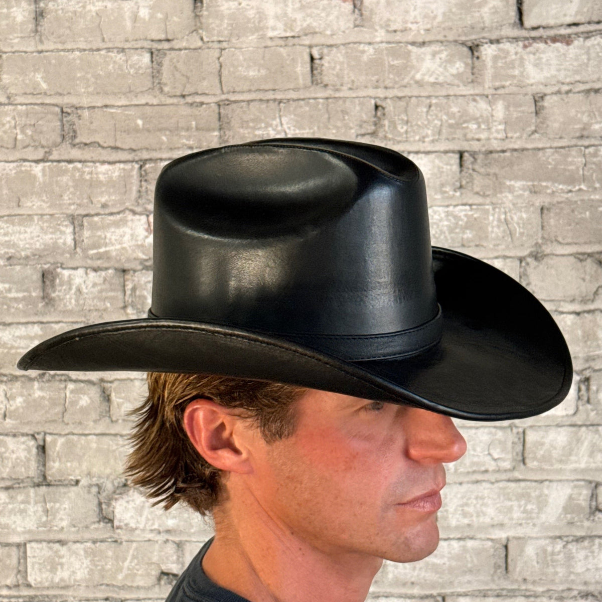 Full grain leather hat in Cattleman Black by Rockmount Ranch Wear with curved brim and stitched crown