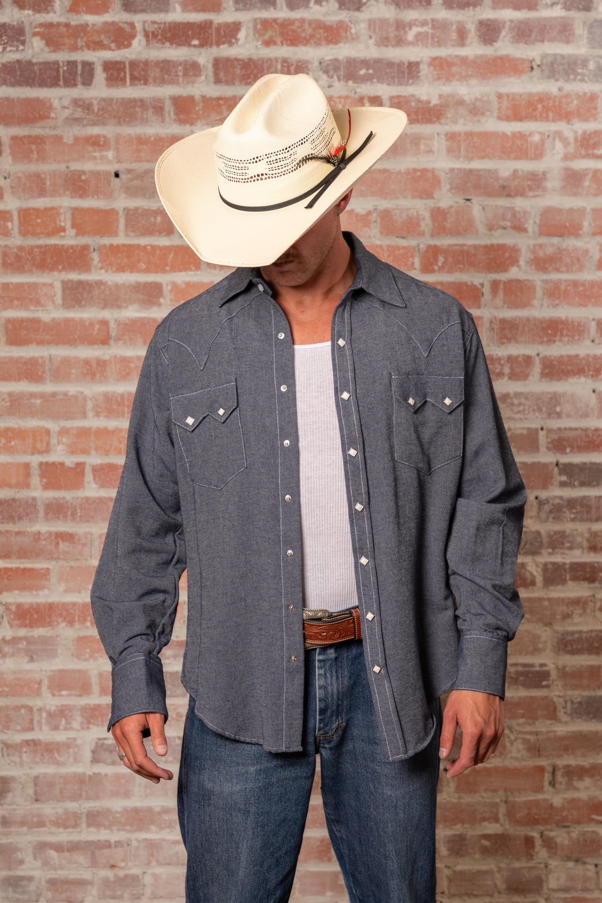 Men's Laundered Blue Chambray Premium Cotton Western Shirt by Rockmount Ranch Wear with sawtooth pocket and diamond snap design