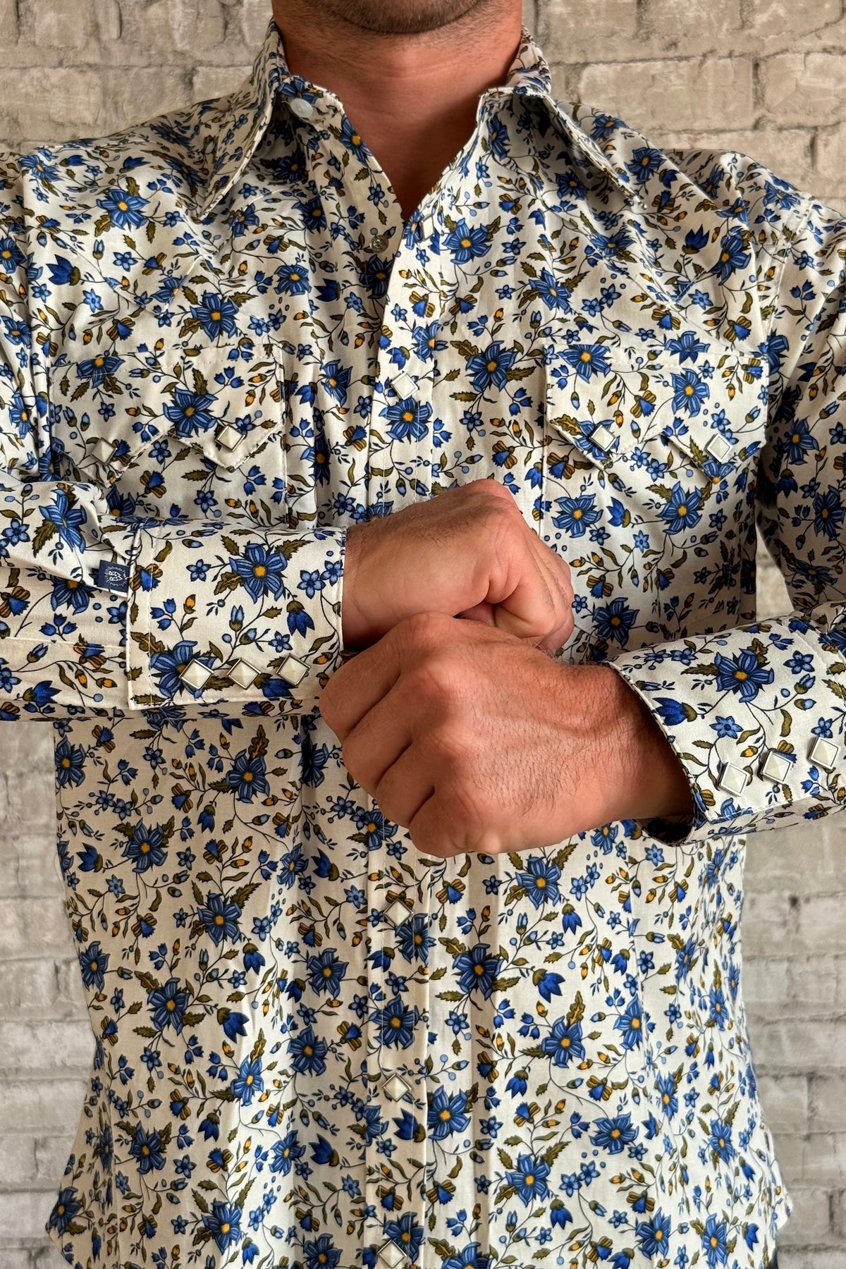Rockmount Men's Ivory Floral Print Western Shirt with blue floral print, sawtooth pockets, and diamond snaps