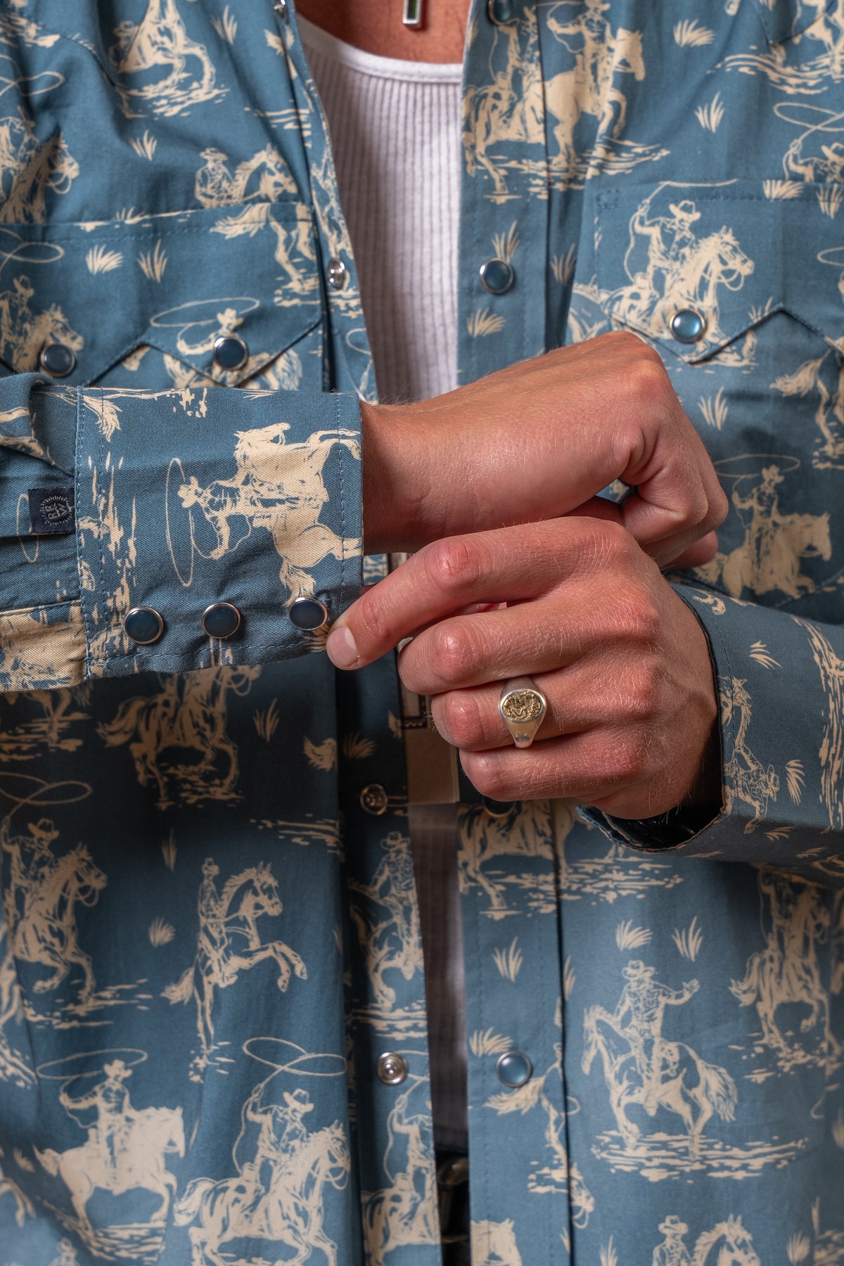 Men's Blue Print Western Shirt by Rockmount Ranch Wear in vintage blue with cowboy print and snaps