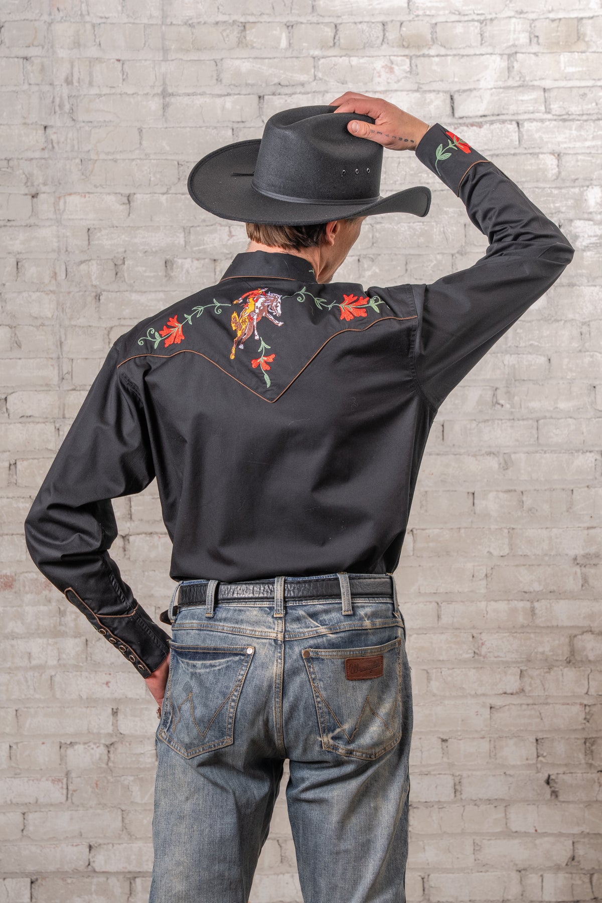 Men's vintage black Bronc embroidered western shirt by Rockmount Ranch Wear with floral fringe and snap buttons