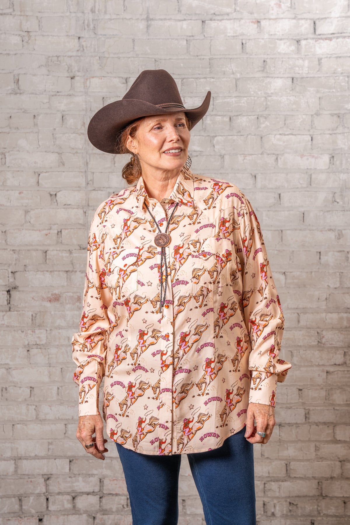 Women's Howdy Print Western Shirt by Rockmount Ranch Wear in vintage cowboy print with embroidered arrowhead pockets