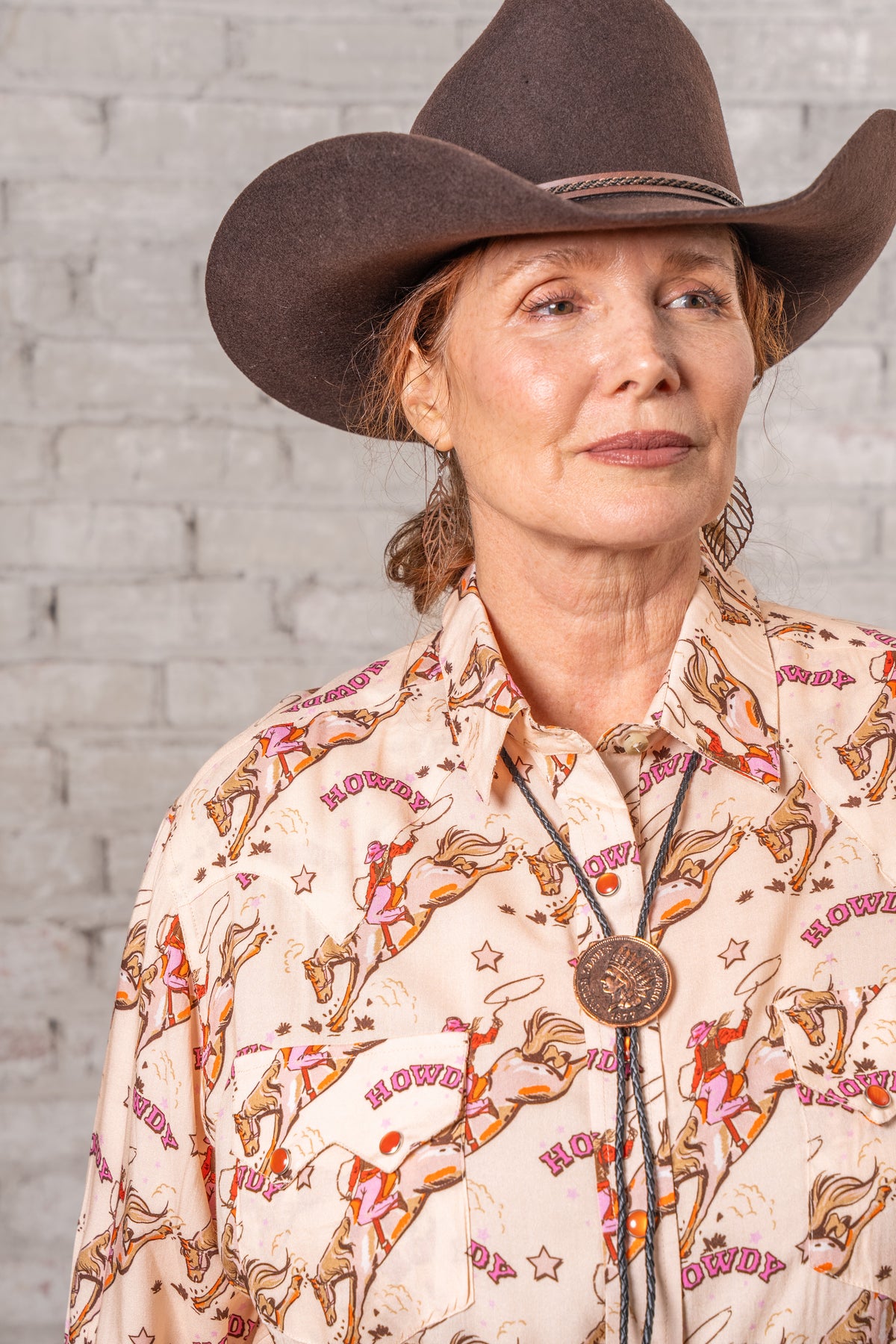Women's Howdy Print Western Shirt by Rockmount Ranch Wear in vintage cowboy print with sawtooth smile pockets