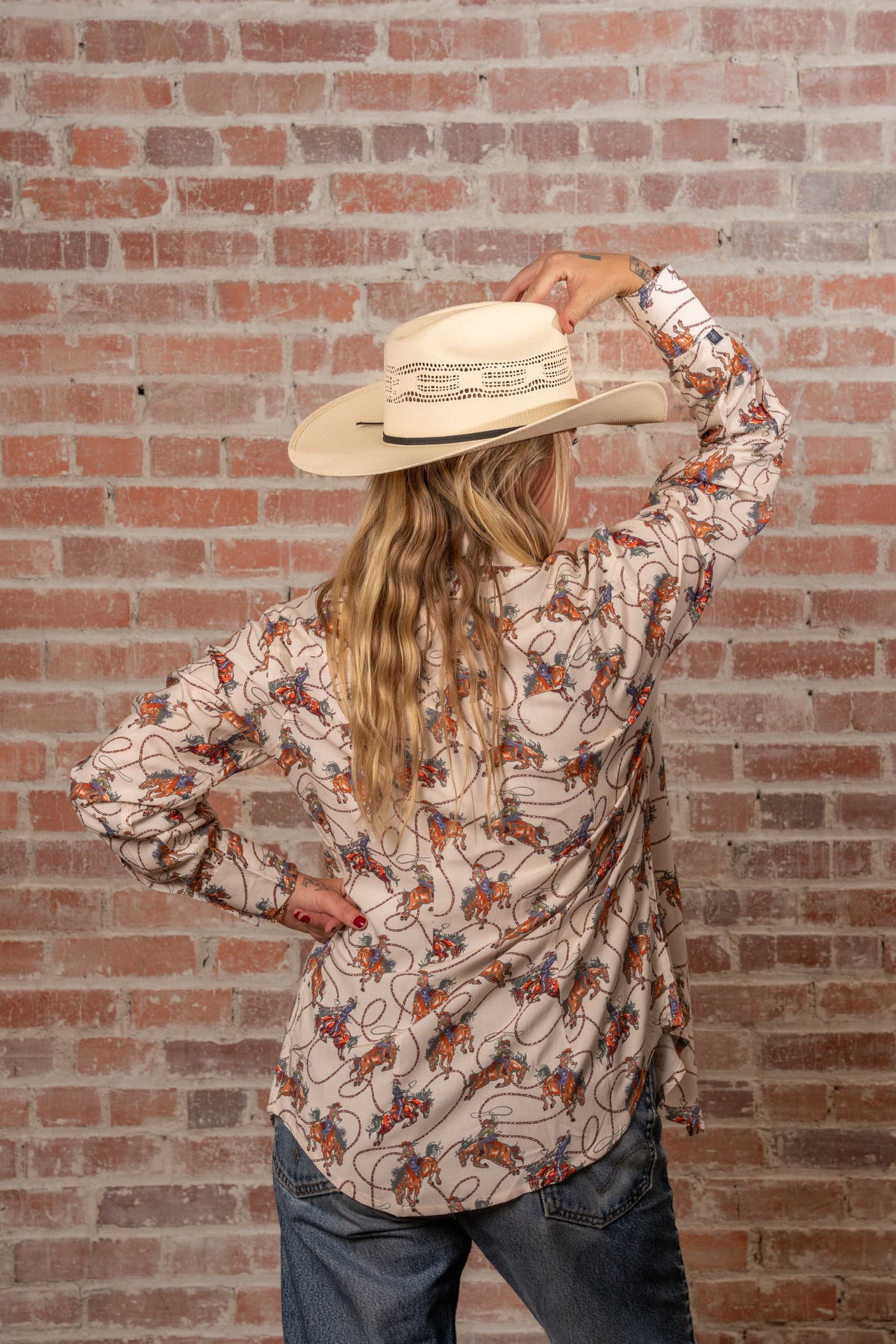 Women's Natural Western Print Shirt by Rockmount Ranch Wear in ivory with cowboy print and sawtooth pocket snaps