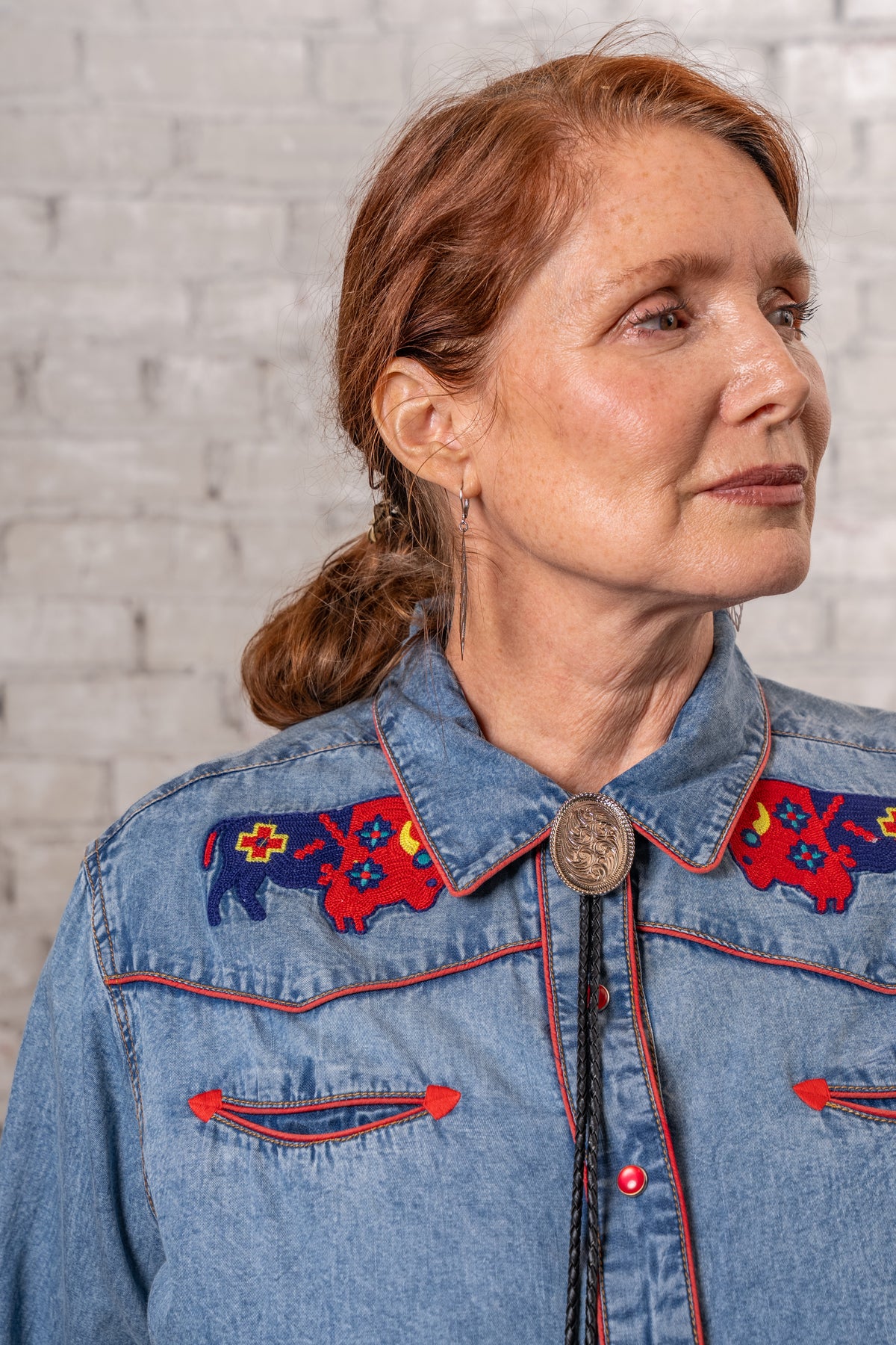 Women's Denim American Bison Embroidered Western Shirt by Rockmount Ranch Wear in denim with chenille floral snaps