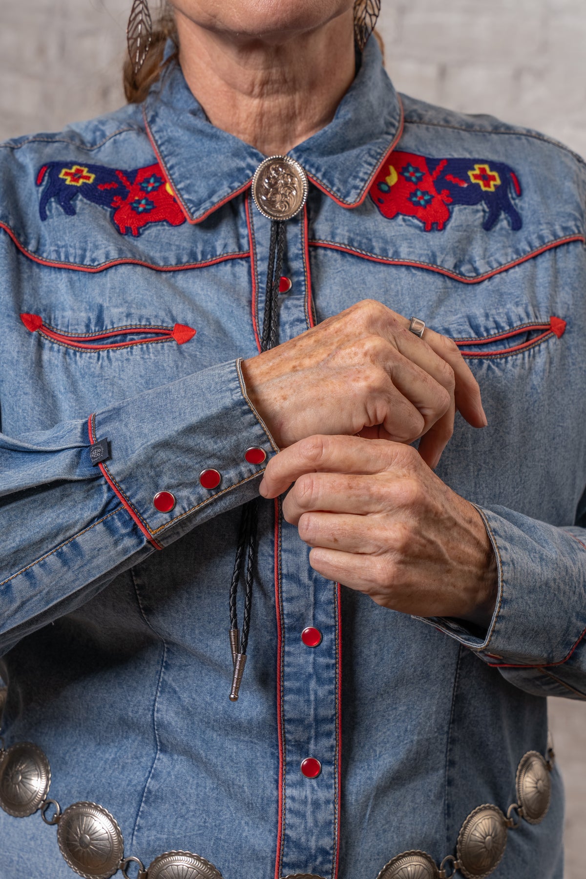 Women's Denim American Bison Embroidered Western Shirt by Rockmount Ranch Wear in vintage denim with chenille floral snaps