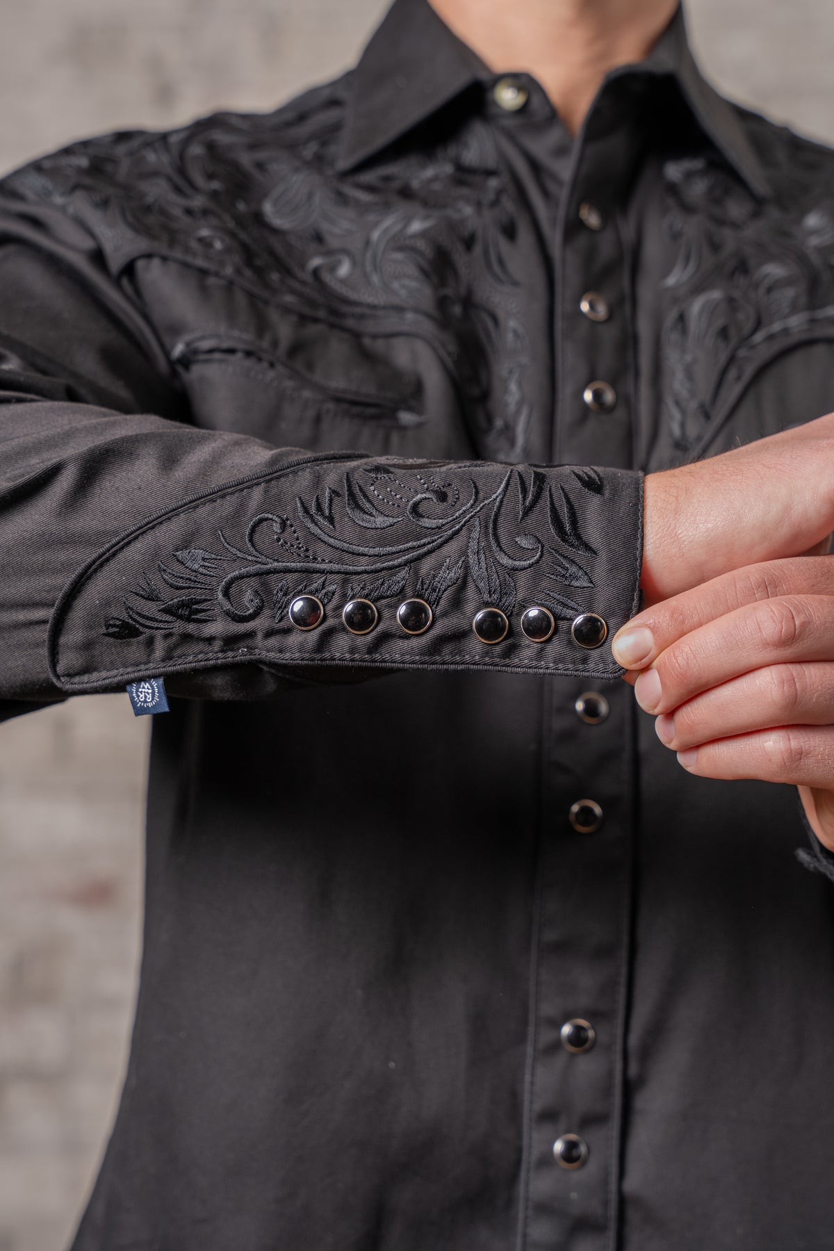 Men's Vintage Black-on-Black Tooling Embroidered Western Shirt by Rockmount Ranch Wear with snap button cuffs