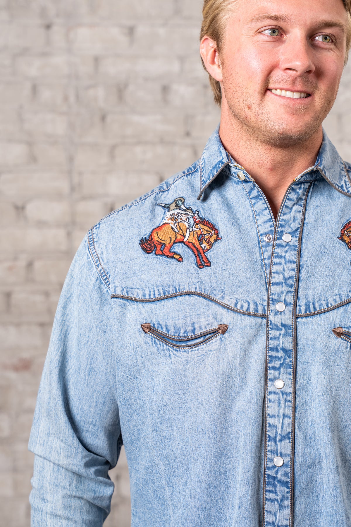 Men's Denim Iconic Bronc Embroidery Western Shirt by Rockmount Ranch Wear in vintage denim with finely detailed embroidery