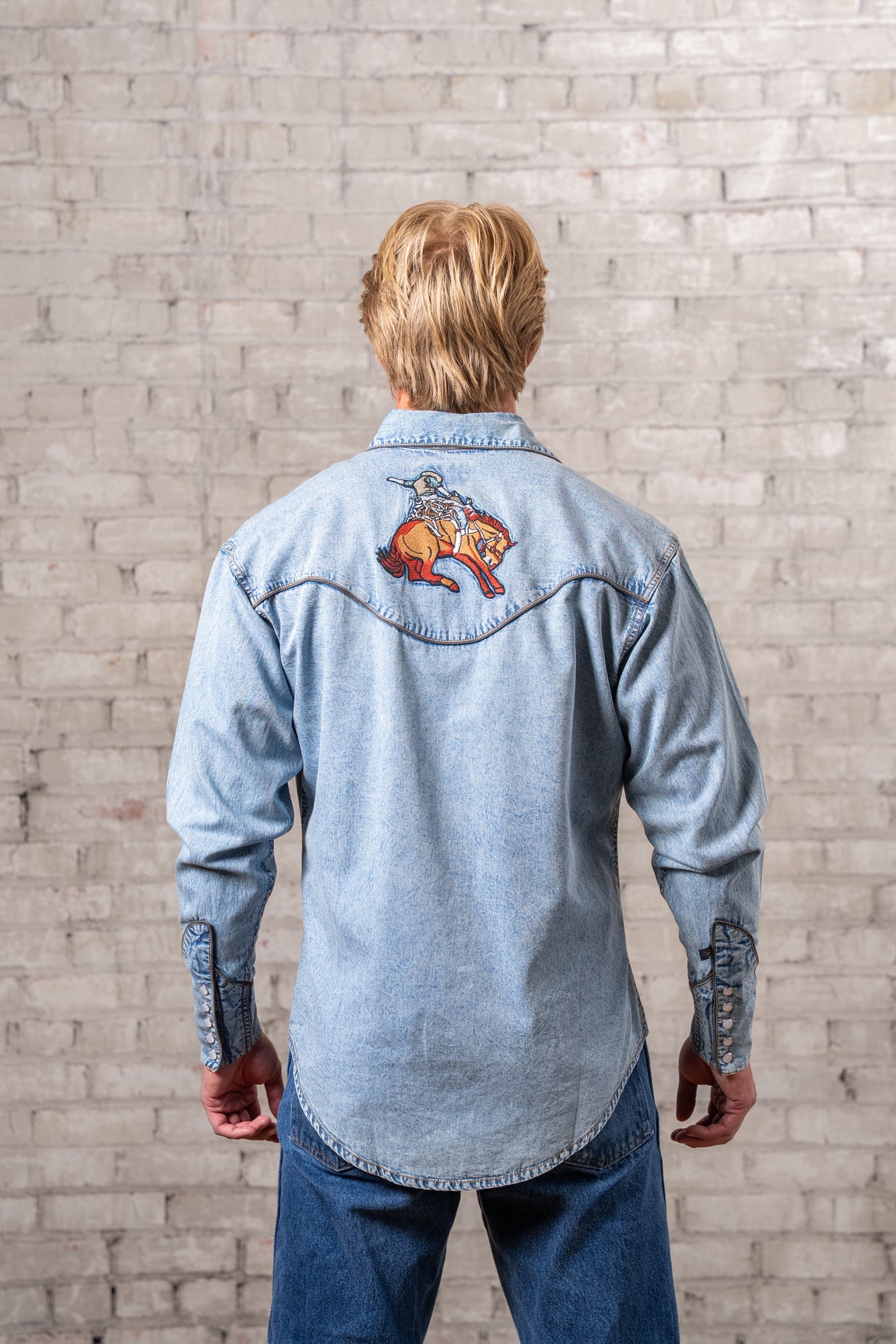 Men's Denim Iconic Bronc Embroidery Western Shirt by Rockmount Ranch Wear in denim with finely detailed embroidery